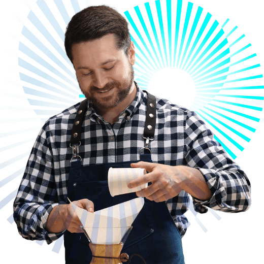 Empresario inscrito al Permio a la Excelencia preparando un café